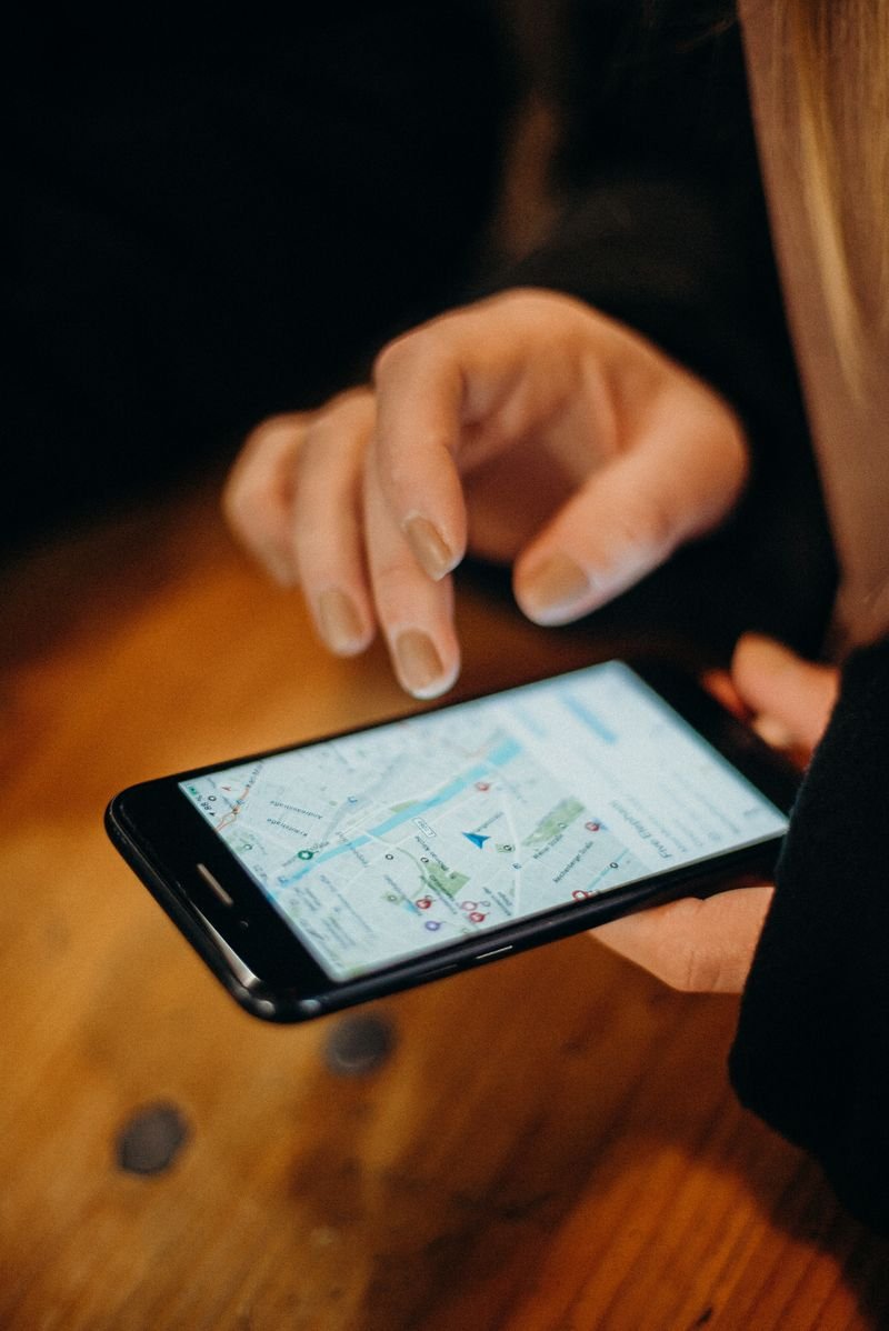 Person checking nearby business pins on a Google Maps navigation app — Local SEO and Google Business Profile optimization service